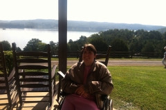 Adult-mom-with-Cerebral-Palsy-enjoys-view-of-river-from-porch