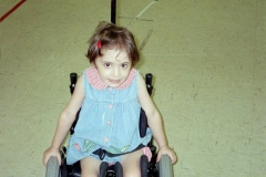 toddler-girl-in-tiny-wheelchair