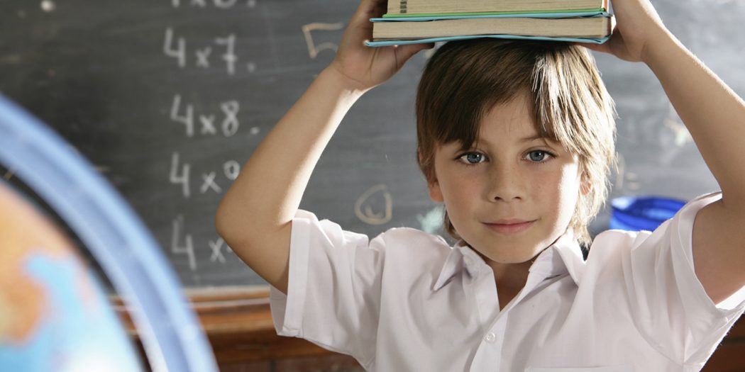 boy w books on head boy w books on head