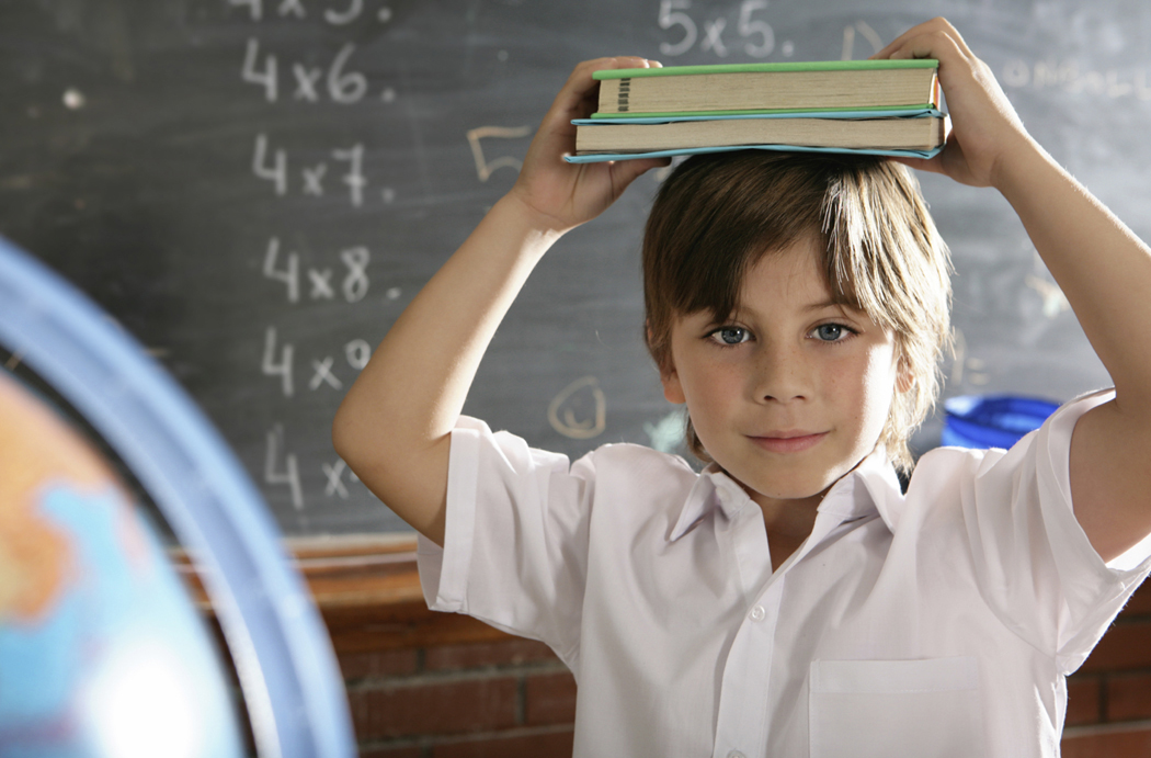 boy w books on head boy w books on head